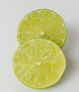 Closeup of a ripe lime fruit cut in half isolated Royalty Free Stock Photo
