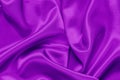 Closeup of rippled purple satin fabric