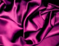 Closeup of rippled purple silk fabric