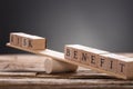 Closeup Of Risk And Benefit Wooden Blocks On Seesaw Royalty Free Stock Photo