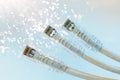 Closeup of RJ45 UTP LAN on the background of optical fibers with blurred lights Royalty Free Stock Photo