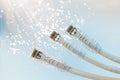 Closeup of RJ45 UTP LAN on the background of optical fibers with blurred lights Royalty Free Stock Photo