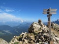 Closeup of road signs in mountains on the scenic mountainscape background, hiking Dolomite Alps