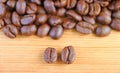 Closeup of Robusta VS Arabica Roasted Coffee Beans with Coffee Beans Pile Royalty Free Stock Photo