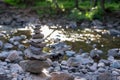 Zen stone cairn along forest stream Royalty Free Stock Photo