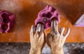 Closeup of rock climber`s hands gripping handhold