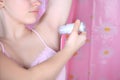 Closeup roll-on deodorant and armpit in the bathroom. Antiperspirants from sweat Royalty Free Stock Photo