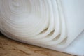Closeup of a roll of white padding for furniture