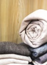 Closeup rolled beige cashmere woollen blanket Royalty Free Stock Photo