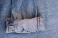 Closeup of the rolled-up sleeve of a denim jacket under the lights Royalty Free Stock Photo
