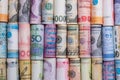 Closeup rolled of variety banknote and multi currency around the world. Exchange rate and Forex investment concept.-Image