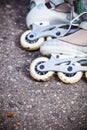 Closeup roller skates on asphalt.