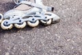Closeup roller skates on asphalt.