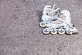 Closeup roller skates on asphalt.