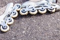 Closeup roller skates on asphalt.