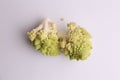 Closeup of Romanesco broccoli vegetable on a white surface