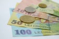 Closeup of Romanian currency coins and banknotes with selective focus on foreground Royalty Free Stock Photo