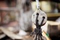 Closeup of the ropes of an old ship under the sunlight with a blurry background Royalty Free Stock Photo