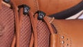 Closeup of rotating pair of fashionable weatherproof leather rufous boots