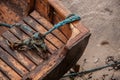 Closeup of a rotten, stranded boat with distorted knots of ropes