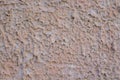 Rough textured plaster wall with uneven beige stucco surface background. Royalty Free Stock Photo