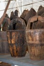 Closeup of a row of traditional vintage wooden buckets in a flea market