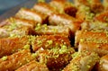 Rows of Delectable Baklava Pastries Topped with Chopped Pistachio Nuts Royalty Free Stock Photo