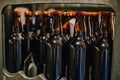 Closeup of rows of unlabeled brown bottles with beverage in a metal case