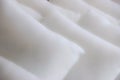 Closeup of rows of white fluffy pillows