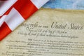 Closeup of ruffled American flag on the preamble to the Constitution of the United States of America Royalty Free Stock Photo