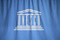 Closeup of Ruffled UNESCO Flag, UNESCO Flag Blowing in Wind Royalty Free Stock Photo