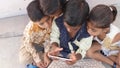 Closeup of rural children using a tablet, India. Royalty Free Stock Photo