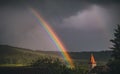 Closeup of rural German country with a beautiful rainbow during cloudy weather, Baden-Wurttemberg