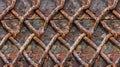 Closeup of a rusty mesh fence displaying a gridlike pattern of oxidized metal strands Royalty Free Stock Photo