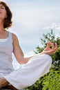 Closeup of a 50s yoga woman sitting in lotus position Royalty Free Stock Photo