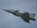 Closeup of Saab JAS 39 Gripen flying in the sky at an air show in Slovakia