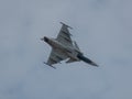 Closeup of Saab JAS 39 Gripen flying in the sky at an air show in Slovakia