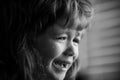 Closeup of a sad child face crying with tears. Royalty Free Stock Photo