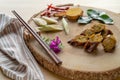 Closeup of Sai Ua slices with spice and chopsticks on a wooden board on the table