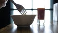 Closeup of salad and a glass of tomato juice in the cafe. Girl eating lunch in a cafe Royalty Free Stock Photo