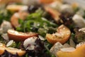 Closeup salad with nectarines, mozzarella and mixed greens