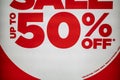 Closeup Red and White 50% Off Sale Sign on Fashion Store Exterior Royalty Free Stock Photo