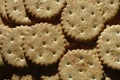 Closeup of salted crackers. Background image of classic salty cracker on a brown wooden tabl Royalty Free Stock Photo
