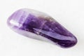 Polished Amethyst rock on white marble
