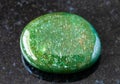 polished green Aventurine gem stone on black