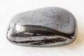 Polished Hematite rock on white marble