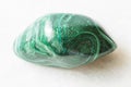 Polished Malachite rock on white marble Royalty Free Stock Photo