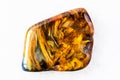 Polished Pietersite rock on white marble Royalty Free Stock Photo