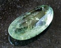 polished Prasiolite (green quartz) rock on black