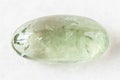 Polished Prasiolite green quartz rock on white